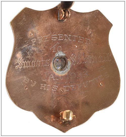 smoot-schmid_badge_back_rr-auction_june-2017