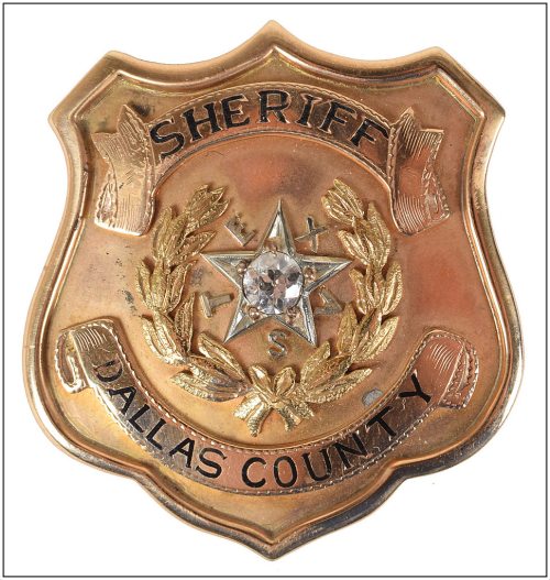 smoot-schmid_badge_front_rr-auction_june-2017